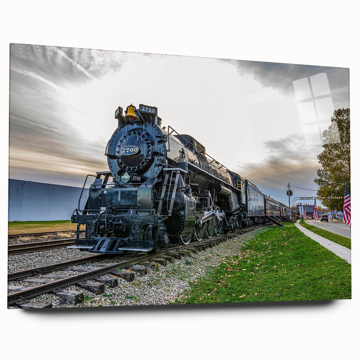 Side view of a large abstract train print in muted metallic tones on acrylic glass, suitable for bedroom or dining room art.