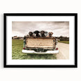 Extra large abstract art print featuring colorful, textured trucks, framed in black, ideal for living room decor.