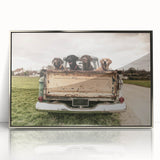 Mid-century modernist art featuring a series of stylized trucks in monochrome shades, framed in silver acrylic.