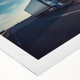 Art deco poster featuring a series of stylized vintage trucks in muted colors on rolled canvas.